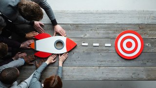 Business people with rocket