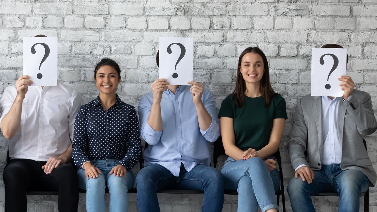 Three happy job applicants being chosen among diverse candidates