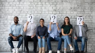 Three happy job applicants being chosen among diverse candidates