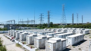 Aerial view of battery energy storage systems under a clear blue sky