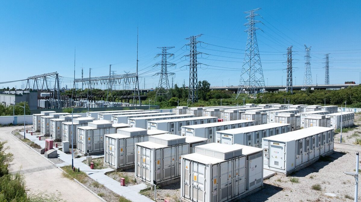 Aerial view of battery energy storage systems under a clear blue sky