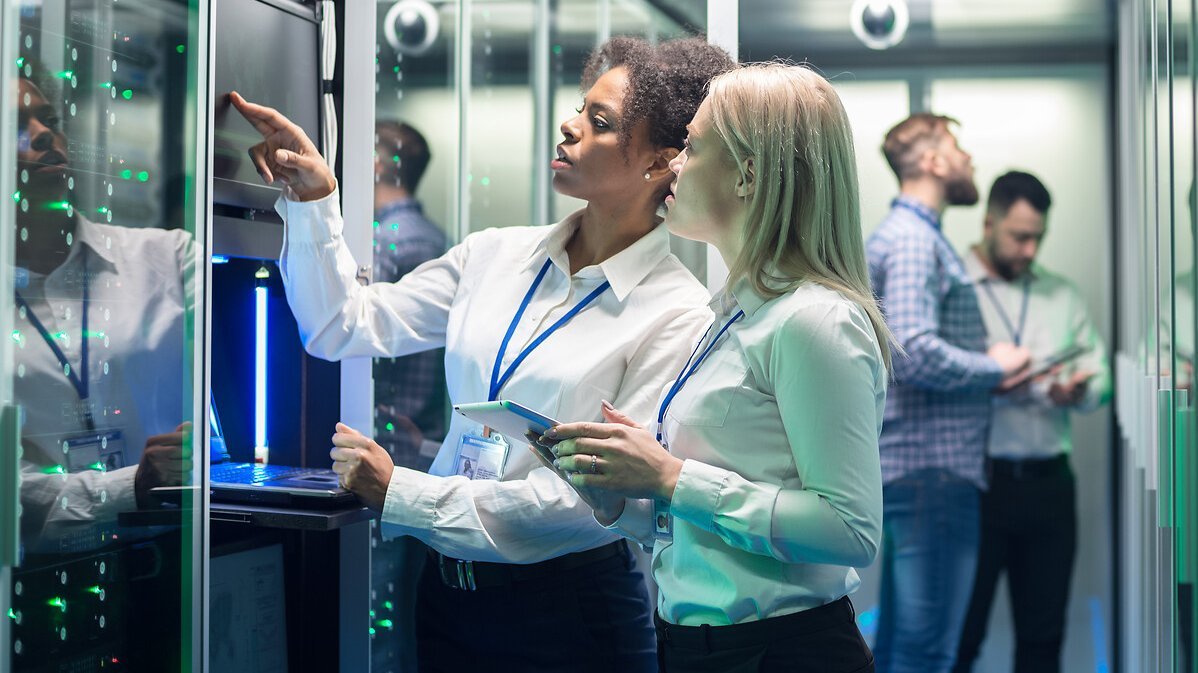 IT engineer with tablet in server room
