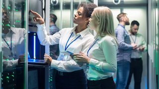IT engineer with tablet in server room