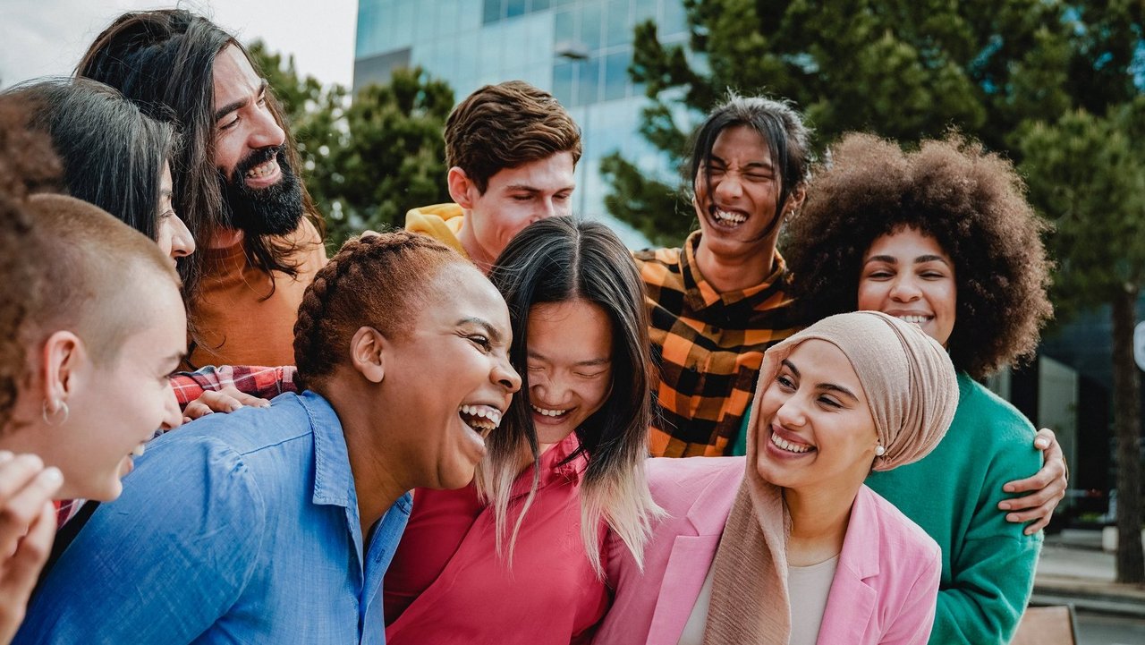 Young multiracial group of people having fun outdoor - Focus on arabian girl face