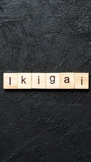 ikigai word written on wood block. ikigai text on table, concept