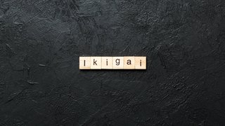 ikigai word written on wood block. ikigai text on table, concept