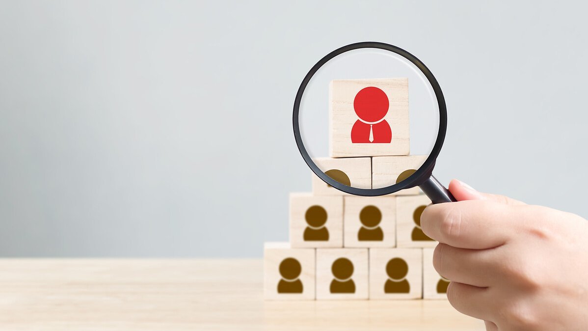 Human resources management and recruitment business hiring concept, Hand held magnifying glass, Copy space for your text