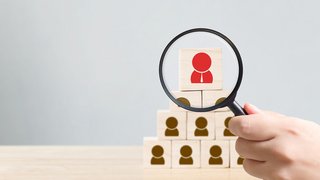 Human resources management and recruitment business hiring concept, Hand held magnifying glass, Copy space for your text