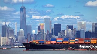 Large container ship with import products enters port in New York