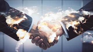 Double exposure of business theme hologram and handshake of two men. Success concept.