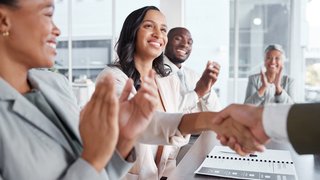 Happy business people, hand shake and success in meeting, support and applause, hiring or team onboarding. Collaboration, shaking hands and congratulations, promotion and achievement with diversity